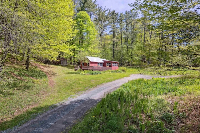 1176 Cross Rd, Strafford, VT 05070 - view of grassy yard with dirt driveway, a view of trees, and a wooden deck