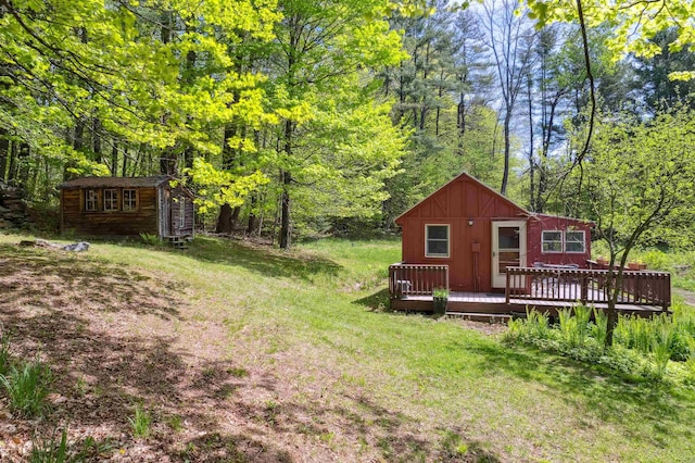 1176 Cross Rd, Strafford, VT 05070 - view of yard with an outbuilding, a deck, and a wooded view