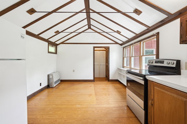 1176 Cross Rd, Strafford, VT 05070 - kitchen with stainless steel electric range, freestanding refrigerator, heating unit, and light wood finished floors