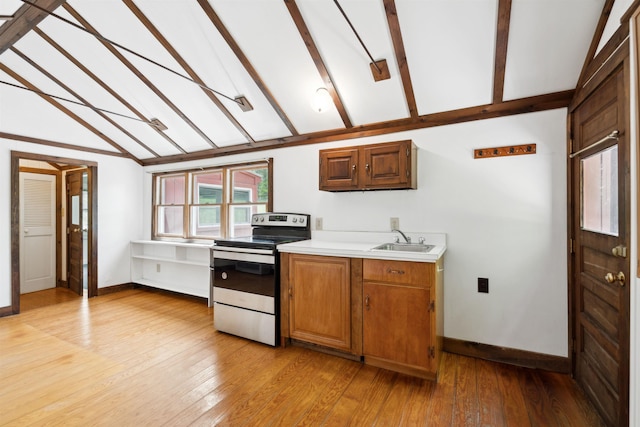 1176 Cross Rd, Strafford, VT 05070 - kitchen featuring stainless steel electric range oven, light countertops, baseboards, and a sink