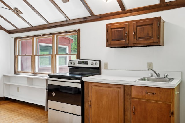 1176 Cross Rd, Strafford, VT 05070 - kitchen featuring stainless steel electric range, a sink, light countertops, light wood-style flooring, and brown cabinets