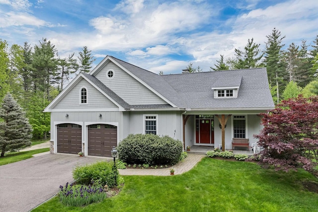 138 Oak Hill Rd, Barrington, NH 03825 - view of front of home with asphalt driveway, a porch, a front lawn, board and batten siding, and a chimney