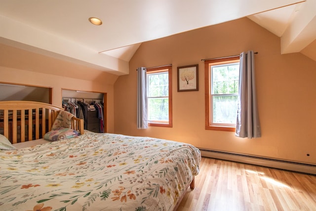 174 Andrews Rd, Holland, VT 05830 - bedroom with vaulted ceiling, baseboard heating, wood finished floors, recessed lighting, and a closet