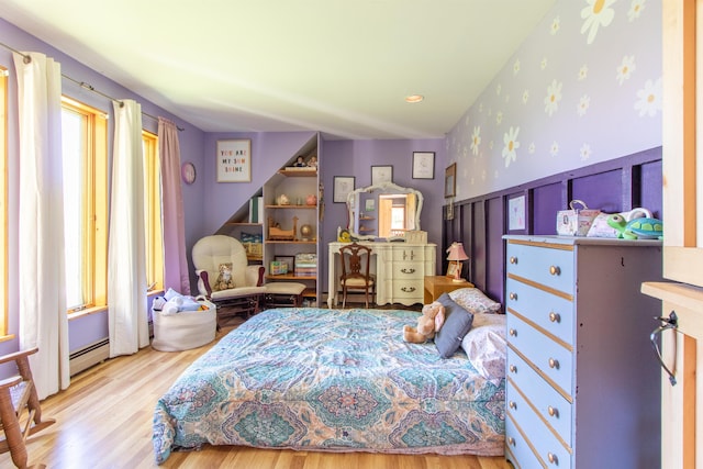 174 Andrews Rd, Holland, VT 05830 - bedroom featuring wood finished floors, baseboard heating, and wallpapered walls