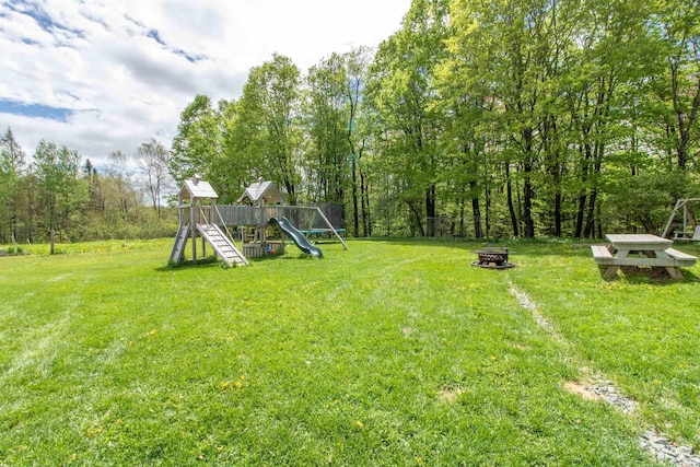 174 Andrews Rd, Holland, VT 05830 - view of grassy yard featuring an outdoor fire pit and a playground