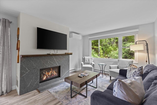 109 Mountainside Dr Unit G202, Stowe, VT 05672 - living area featuring a baseboard heating unit, a baseboard radiator, an AC wall unit, wood finished floors, and a fireplace