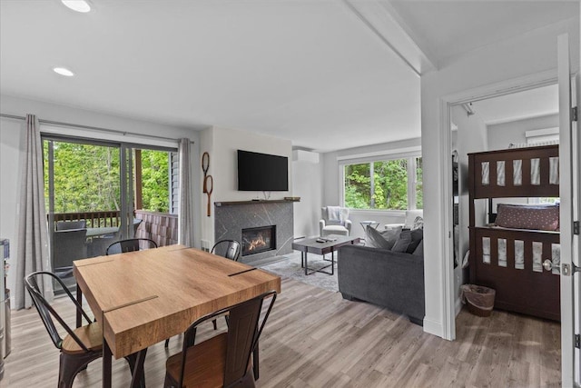 109 Mountainside Dr Unit G202, Stowe, VT 05672 - dining space featuring a fireplace, healthy amount of natural light, light wood-type flooring, and recessed lighting