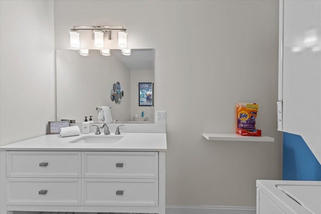109 Mountainside Dr Unit G202, Stowe, VT 05672 - bathroom featuring vanity and washer / clothes dryer