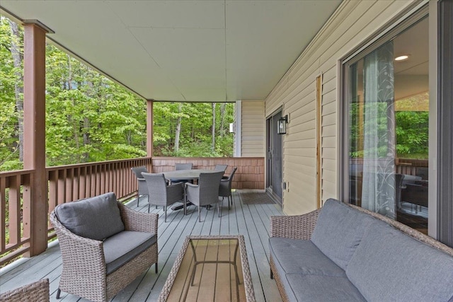 109 Mountainside Dr Unit G202, Stowe, VT 05672 - wooden terrace with outdoor dining space