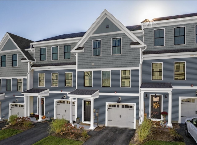 32 Lenox Dr Unit D, Dover, NH 03820 - view of property featuring an attached garage, driveway, and a shingled roof