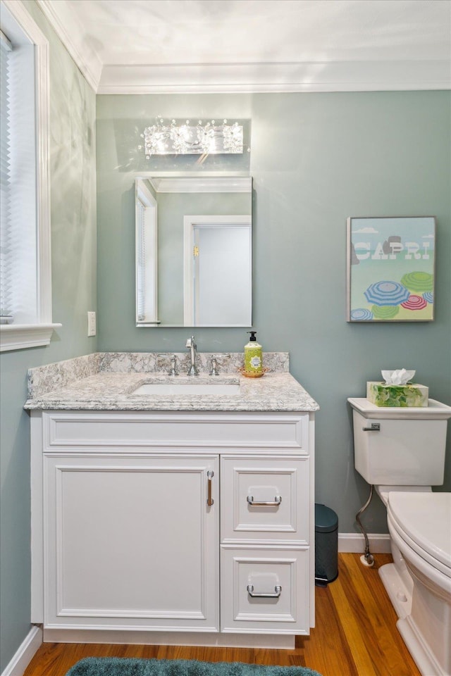 2 Cortland Rd, Milford, NH 03055 - half bath featuring toilet, vanity, crown molding, wood finished floors, and baseboards