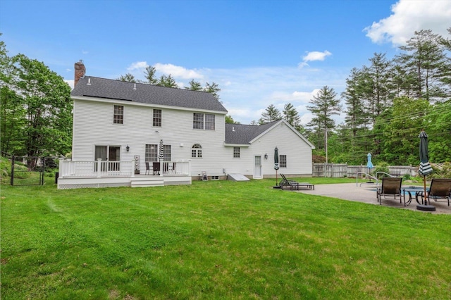 2 Cortland Rd, Milford, NH 03055 - back of property with an outdoor fire pit, a wooden deck, a patio area, a chimney, and roof with shingles