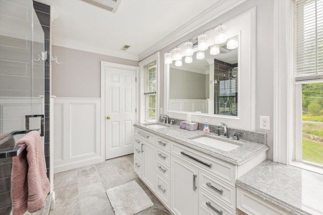 2 Cortland Rd, Milford, NH 03055 - bathroom featuring a decorative wall, crown molding, double vanity, a chandelier, and a wainscoted wall