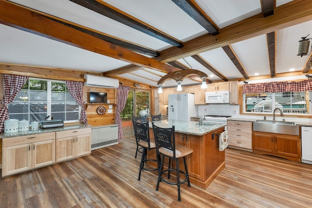 18 Mayflower Ln, Moultonborough, NH 03254 - kitchen with white appliances, a sink, a wall mounted air conditioner, wood finished floors, and plenty of natural light