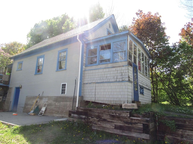 22 Colodny Ter, Newport City, VT 05855 - view of home's exterior featuring a patio