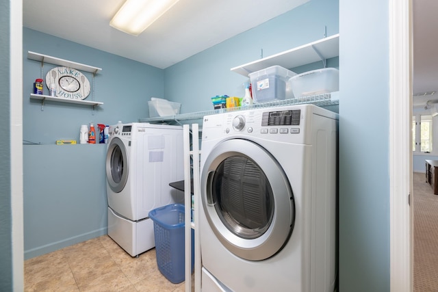 21 Hawk Ridge Rd, Meredith, NH 03253 - laundry room featuring washing machine and dryer and light tile patterned flooring
