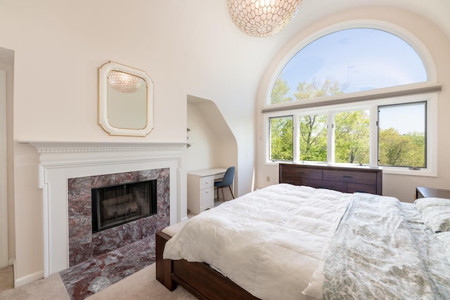 21 Hawk Ridge Rd, Meredith, NH 03253 - bedroom with carpet and a fireplace