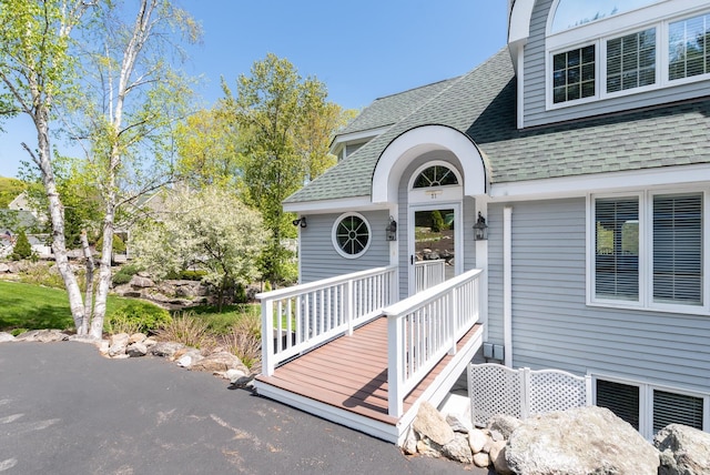 21 Hawk Ridge Rd, Meredith, NH 03253 - view of exterior entry featuring roof with shingles