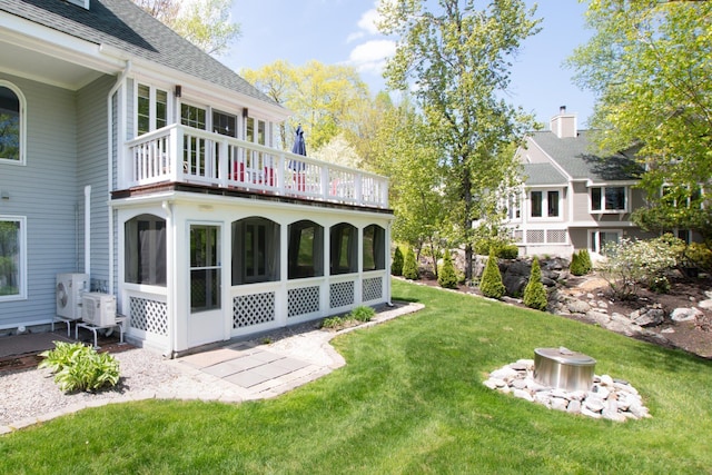 21 Hawk Ridge Rd, Meredith, NH 03253 - view of green lawn featuring a balcony and a cooling unit