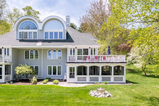 21 Hawk Ridge Rd, Meredith, NH 03253 - back of property featuring a yard, a chimney, and a wooden deck