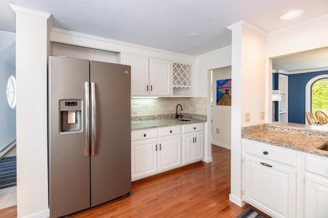 21 Hawk Ridge Rd, Meredith, NH 03253 - kitchen featuring stainless steel fridge, open shelves, crown molding, a sink, and light wood-style floors