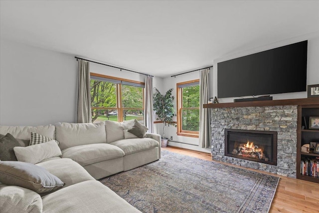 100 Maplewood Ave, Milton, VT 05468 - living area featuring wood finished floors and a fireplace