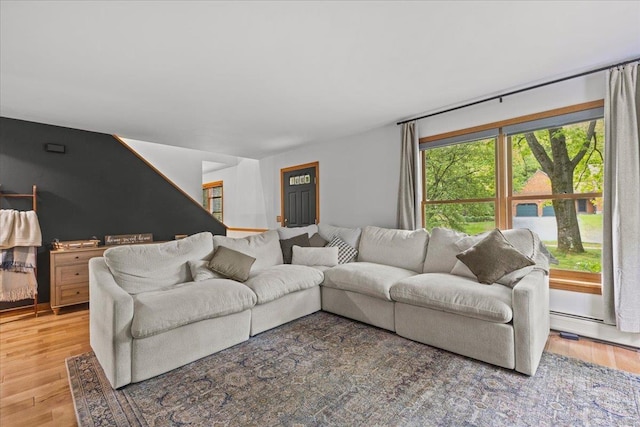 100 Maplewood Ave, Milton, VT 05468 - living area featuring light wood-style flooring and a baseboard radiator