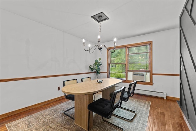 100 Maplewood Ave, Milton, VT 05468 - dining space with baseboard heating, a chandelier, wood finished floors, and cooling unit