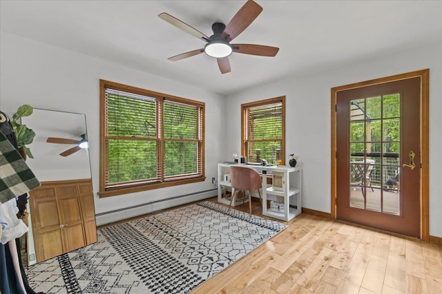 100 Maplewood Ave, Milton, VT 05468 - office area with a baseboard heating unit, a ceiling fan, and light wood-style floors
