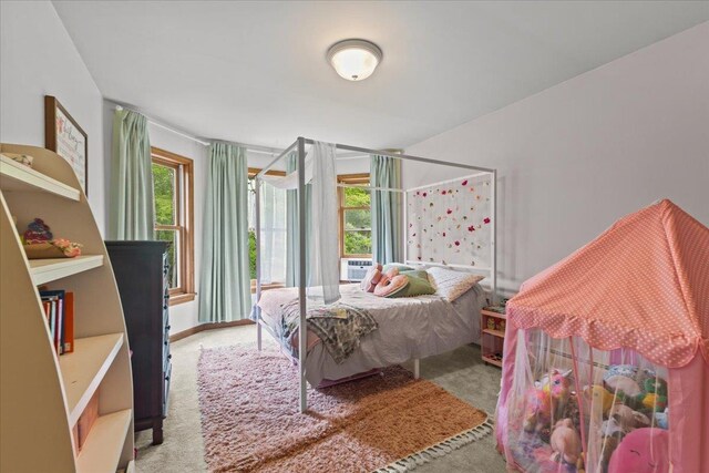 100 Maplewood Ave, Milton, VT 05468 - bedroom with light carpet, multiple windows, and cooling unit