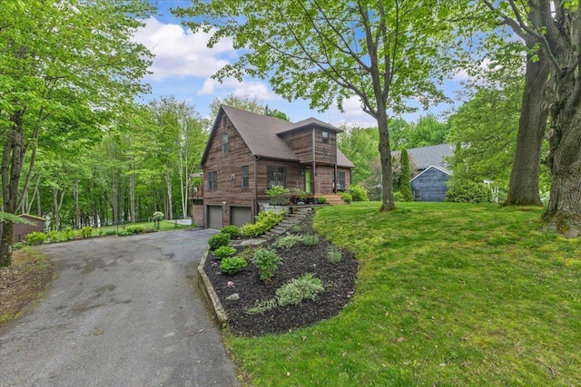 100 Maplewood Ave, Milton, VT 05468 - view of front facade featuring asphalt driveway, an attached garage, and a front yard
