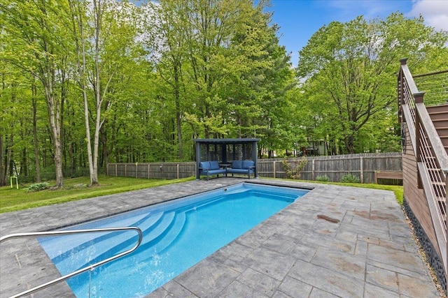 100 Maplewood Ave, Milton, VT 05468 - view of swimming pool featuring a patio, view of scattered trees, and an outdoor living space