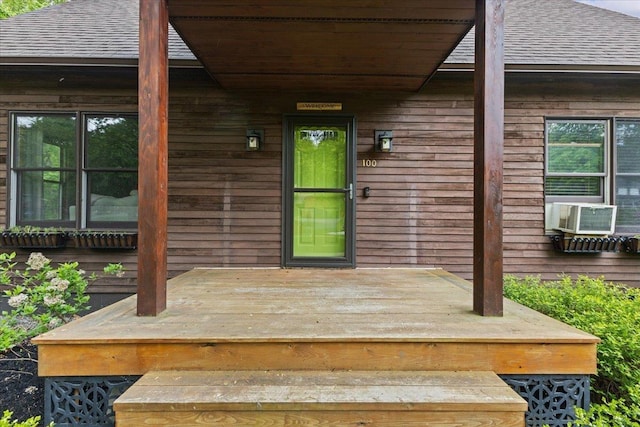 100 Maplewood Ave, Milton, VT 05468 - doorway to property with roof with shingles and cooling unit