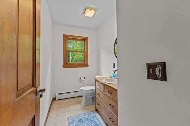 100 Maplewood Ave, Milton, VT 05468 - bathroom featuring baseboard heating, vanity, toilet, baseboards, and tile patterned floors