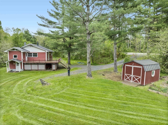 1572 Stowe Hollow Rd, Stowe, VT 05672 - view of green lawn featuring a wooden deck and stairs