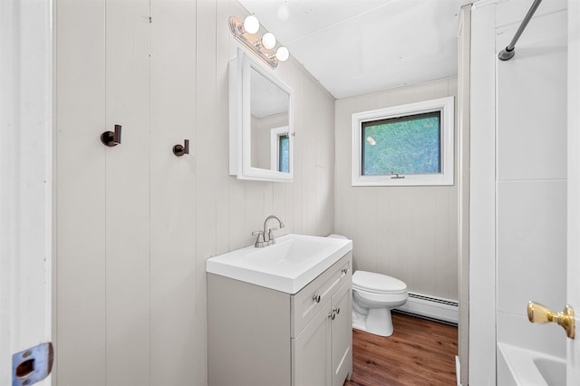 1572 Stowe Hollow Rd, Stowe, VT 05672 - bathroom featuring a baseboard heating unit, vanity, toilet, and wood finished floors
