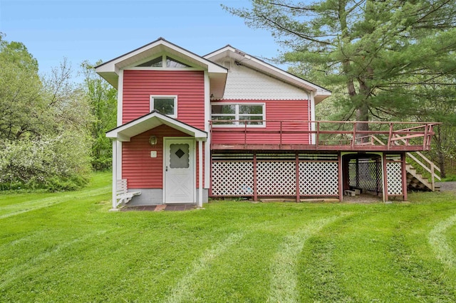 1572 Stowe Hollow Rd, Stowe, VT 05672 - back of house with a deck, a lawn, and stairway