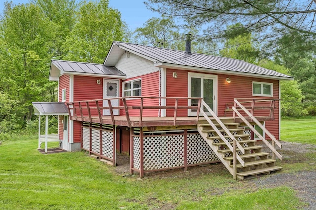 1572 Stowe Hollow Rd, Stowe, VT 05672 - rear view of property featuring a deck, a lawn, metal roof, and a standing seam roof