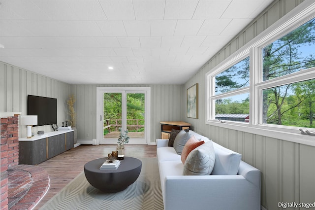 1572 Stowe Hollow Rd, Stowe, VT 05672 - living area featuring light wood-style flooring, healthy amount of natural light, and a baseboard radiator
