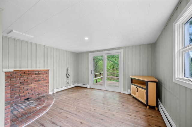 1572 Stowe Hollow Rd, Stowe, VT 05672 - unfurnished living room featuring plenty of natural light and light wood-style floors