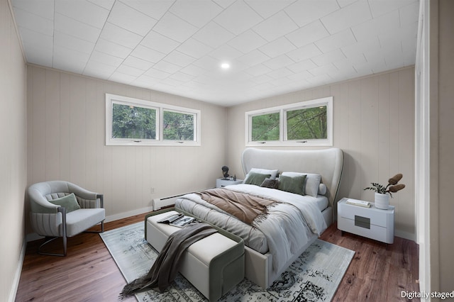 1572 Stowe Hollow Rd, Stowe, VT 05672 - bedroom with wood finished floors, a baseboard radiator, and baseboards