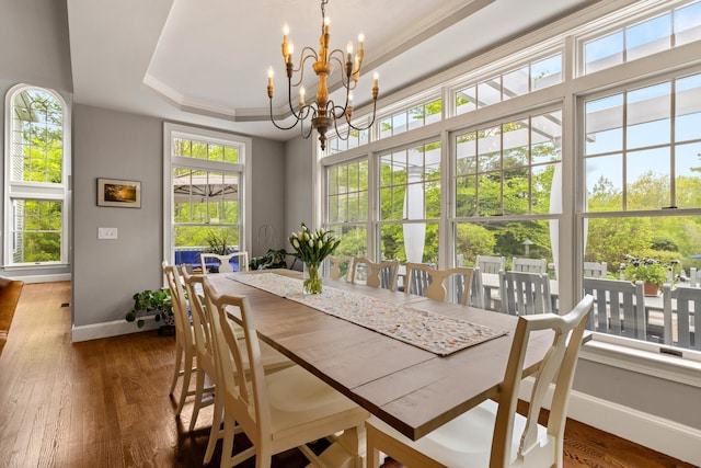 34 Orchard Hill Rd, Greenland, NH 03840 - dining space featuring baseboards, a chandelier, healthy amount of natural light, a raised ceiling, and crown molding