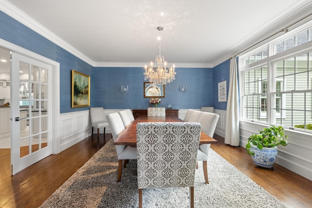 34 Orchard Hill Rd, Greenland, NH 03840 - dining space featuring a chandelier, ornamental molding, wallpapered walls, wood finished floors, and wainscoting