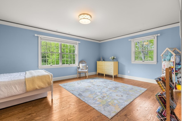 34 Orchard Hill Rd, Greenland, NH 03840 - bedroom featuring ornamental molding, multiple windows, baseboards, and wood finished floors