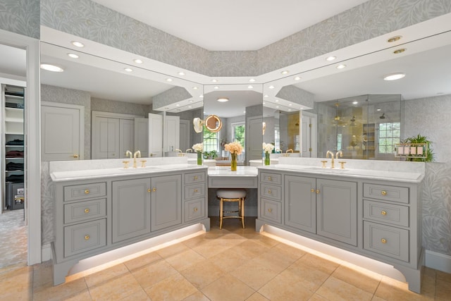 34 Orchard Hill Rd, Greenland, NH 03840 - bathroom featuring wallpapered walls, double vanity, a stall shower, recessed lighting, and a spacious closet