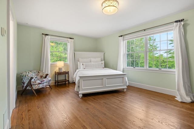 34 Orchard Hill Rd, Greenland, NH 03840 - bedroom with dark wood-style flooring and baseboards