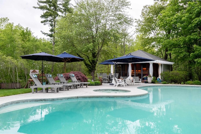 34 Orchard Hill Rd, Greenland, NH 03840 - view of pool with an outdoor hot tub, a patio area, and view of scattered trees