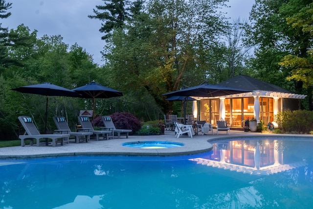 34 Orchard Hill Rd, Greenland, NH 03840 - outdoor pool with an exterior structure, an in-ground hot tub, an outbuilding, and a patio