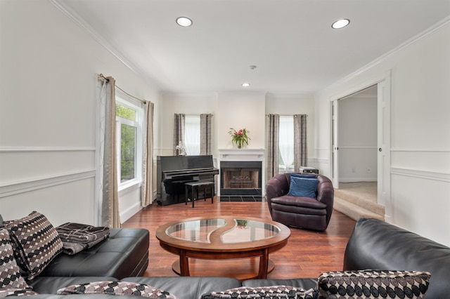 12 Drew Ln, Laconia, NH 03246 - living area with ornamental molding, wood finished floors, recessed lighting, and a fireplace with flush hearth