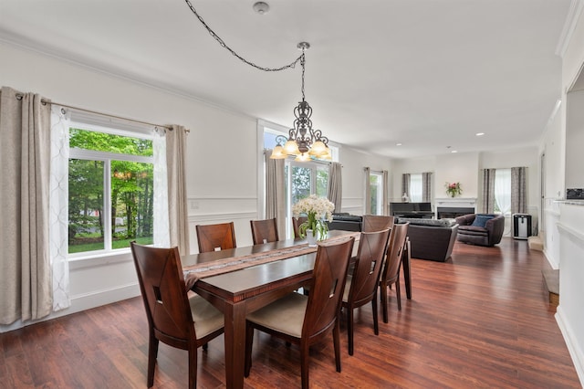 12 Drew Ln, Laconia, NH 03246 - dining space featuring a chandelier, a fireplace, dark wood-style floors, ornamental molding, and recessed lighting